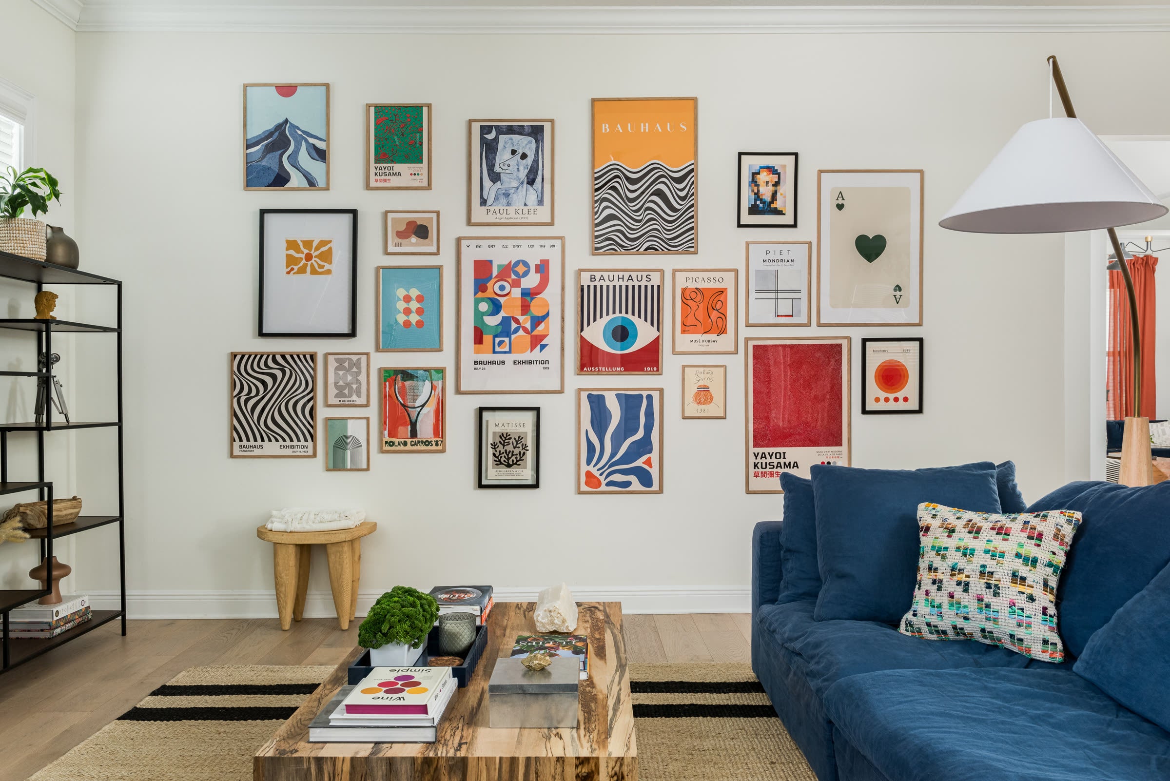 Layered living room and curated art designed by Sixth Sense Studio in St. Petersburg